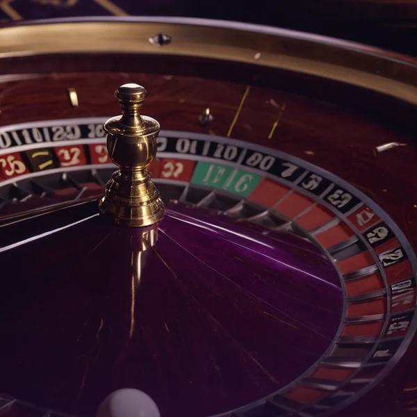 Roulette wheel tile turning beside a stack of chips